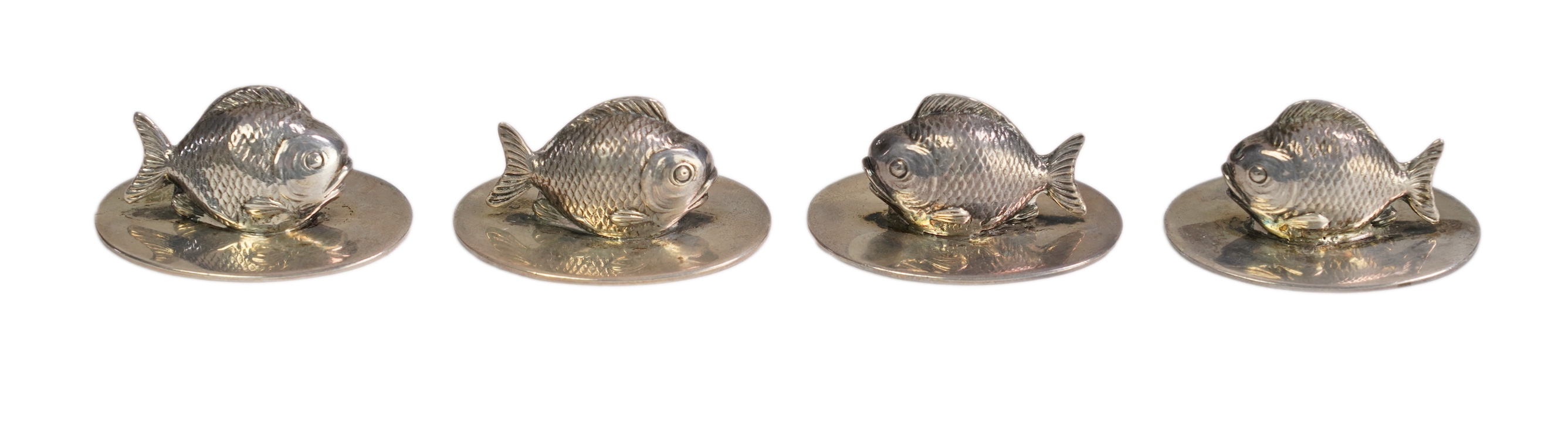 A cased set of two pairs of Edwardian silver menu holders, each modelled as a fish, by Sampson Mordan & Co